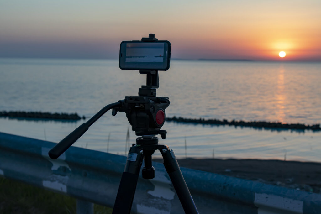 夕日と海とカメラ