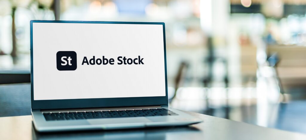 Adobe Stockが表示されたノートパソコン